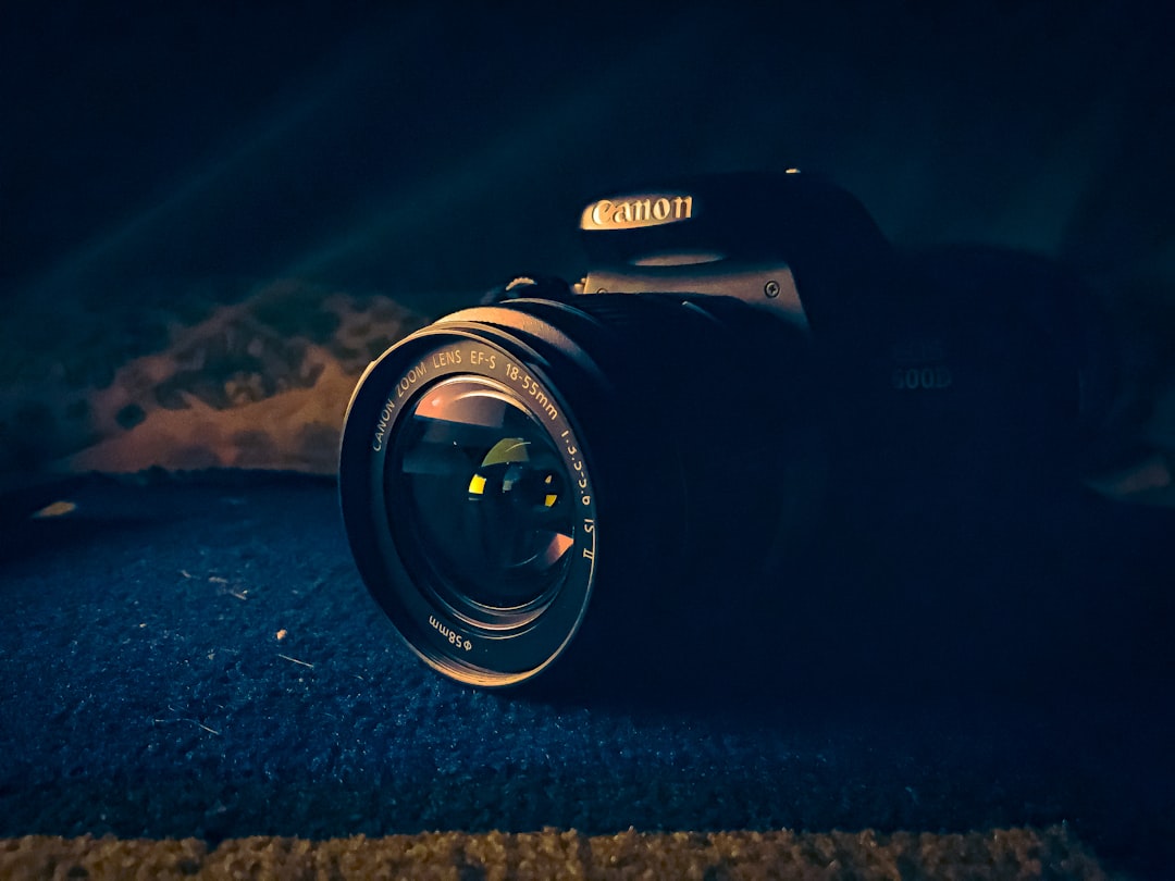 a close up of a camera in the dark, Canon EOS600D clicked from iphone 6s