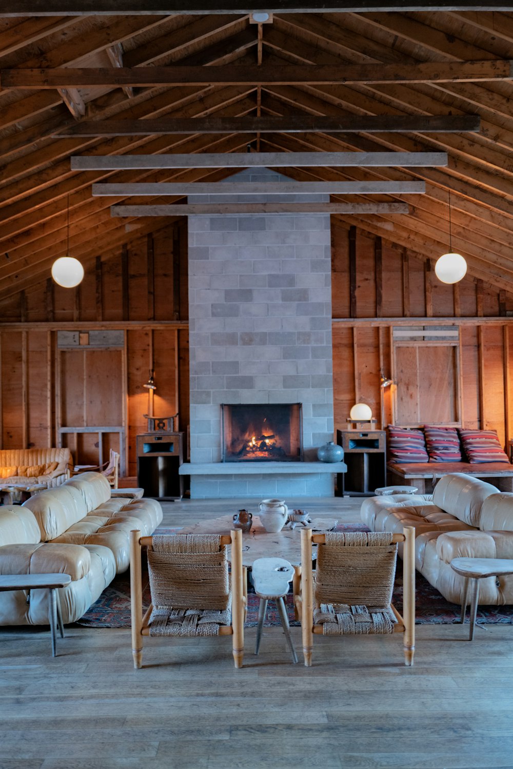 a living room filled with furniture and a fire place