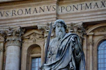 a statue of a man in front of a building