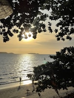 Sunset view over the beach with athletes cooling down after races.