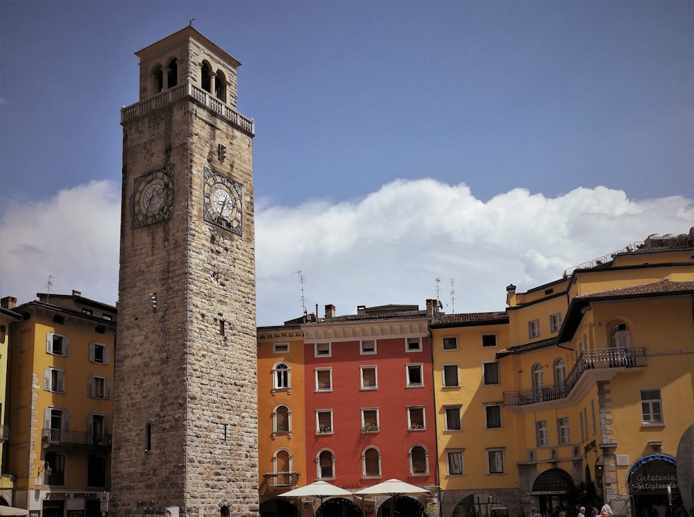 a tall clock tower sitting in the middle of a city