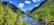 A breathtaking view of the Himalayan mountains with lush greenery and a serene river flowing through the valley.