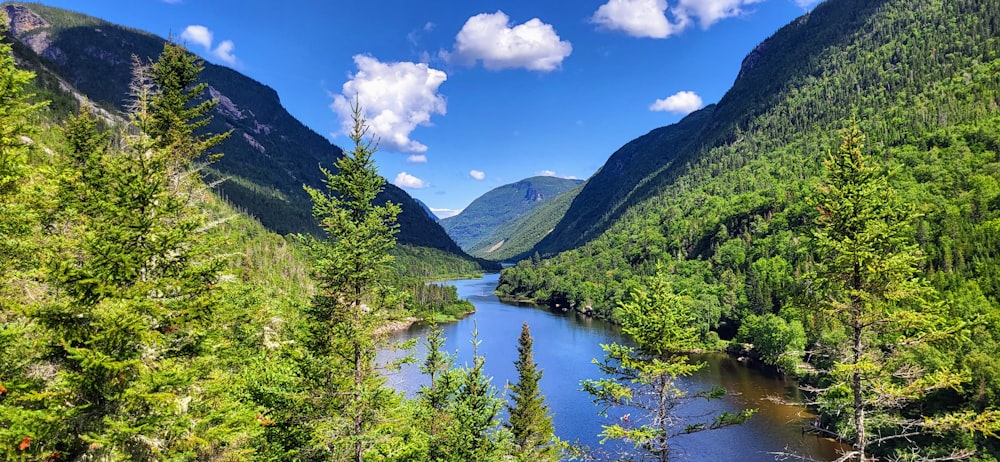 a view of a river surrounded by mountains