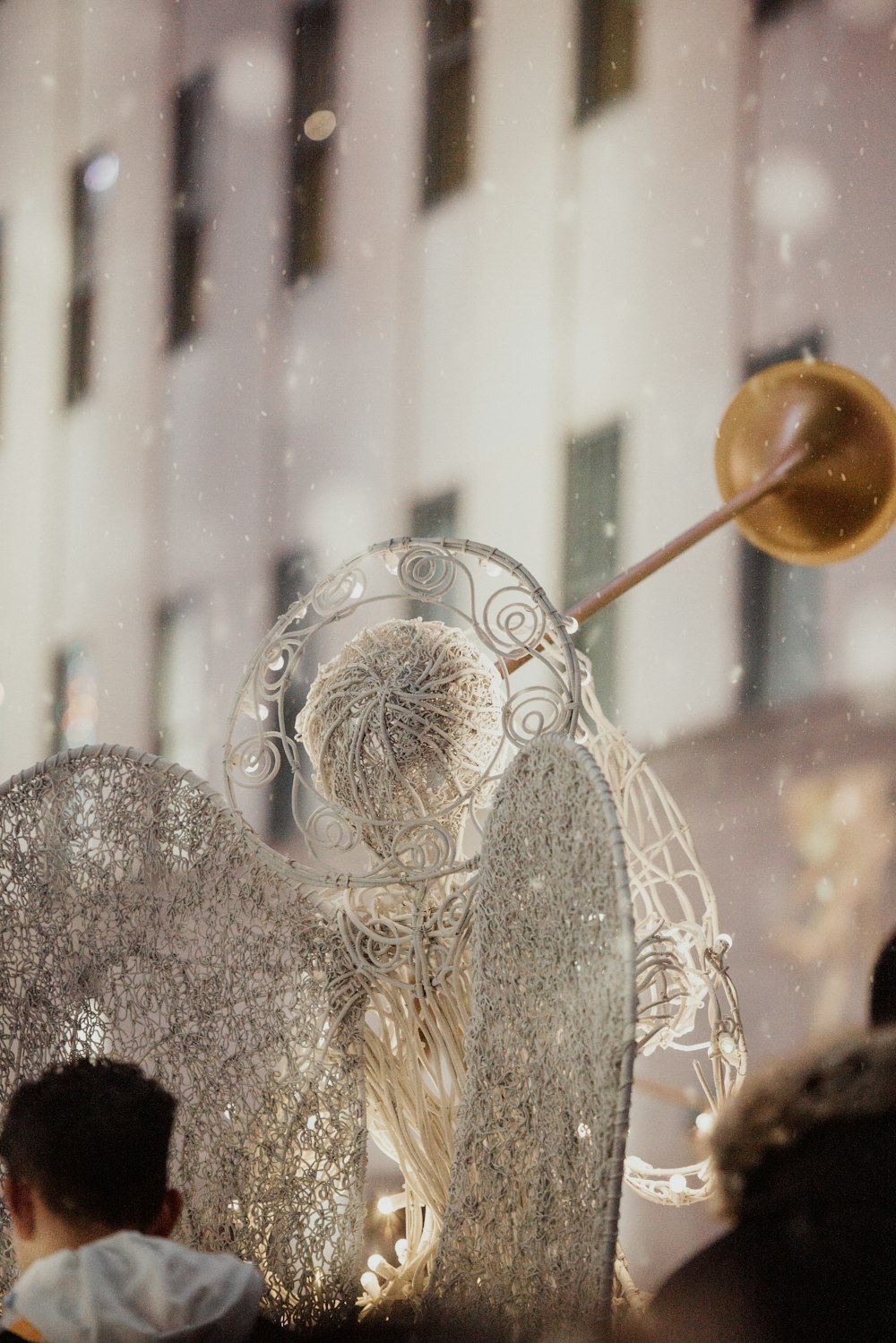 a sculpture of an angel blowing a trumpet