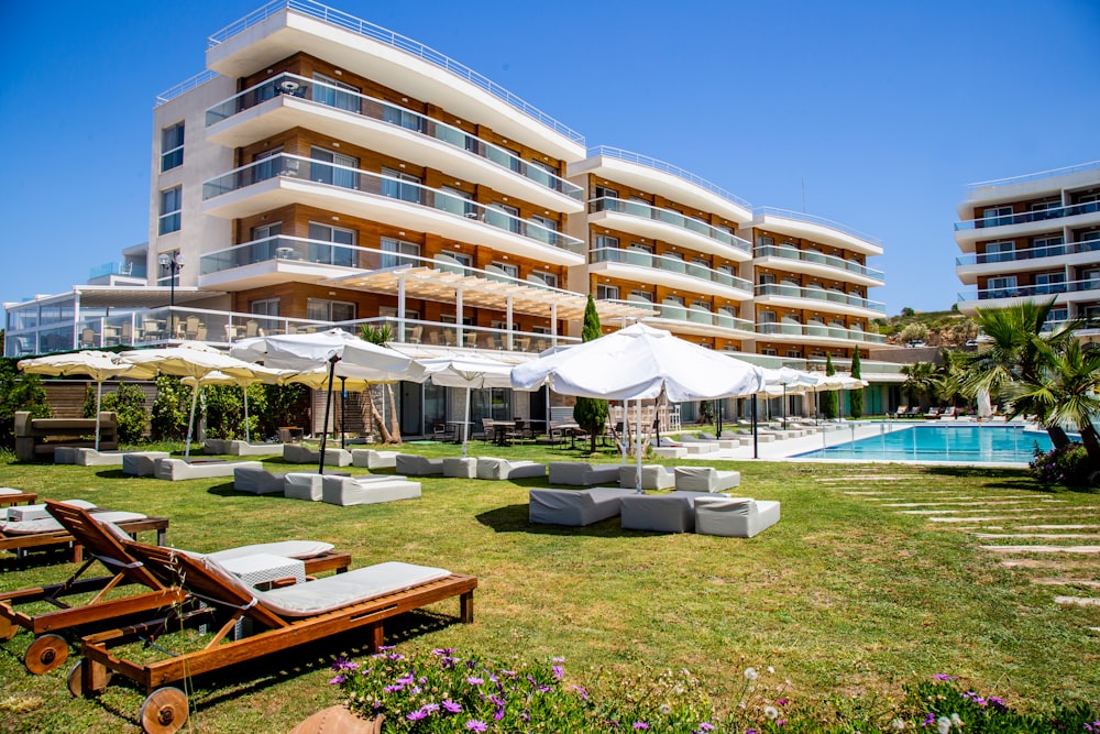 a large building with a pool in front of it