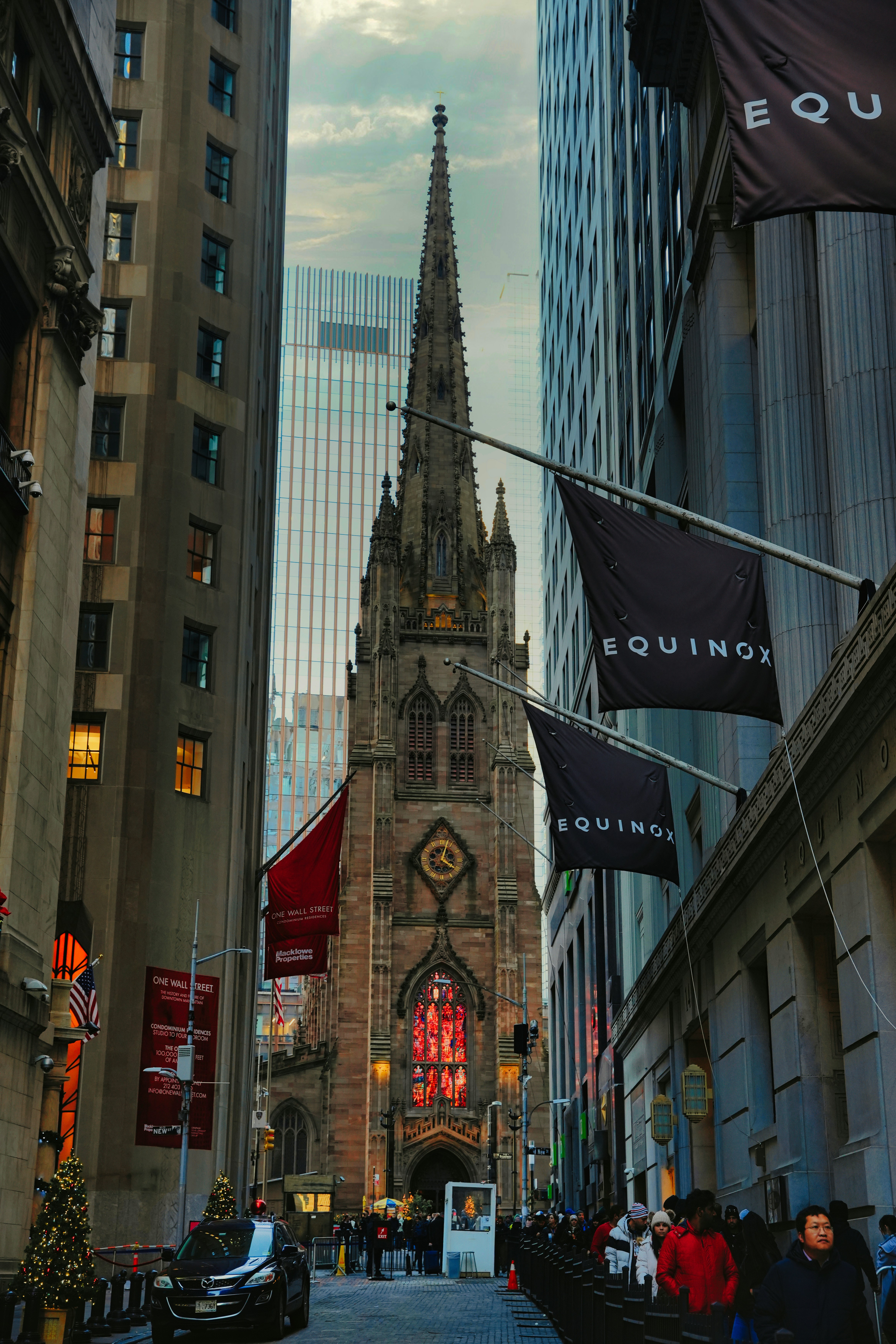 a large cathedral towering over a city filled with tall buildings
