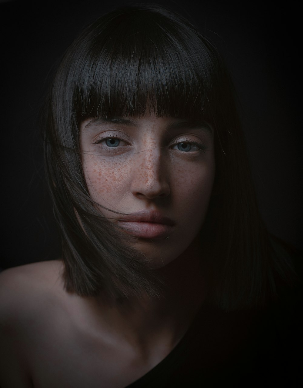 a woman with freckles and freckles on her face