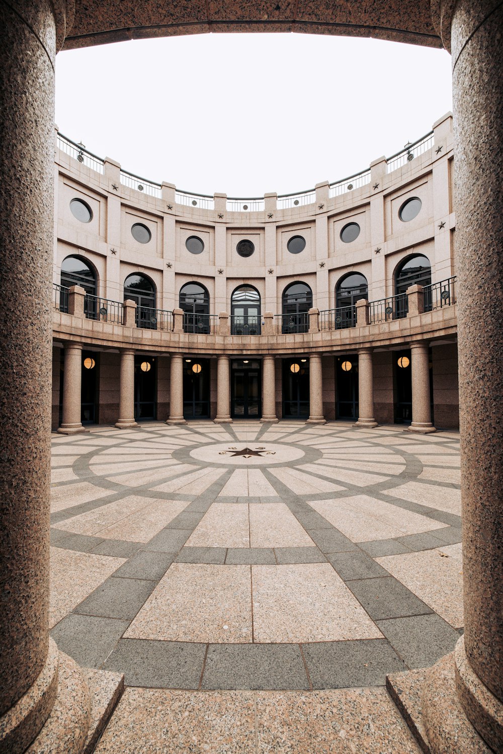 a large building with a circular walkway in the middle of it