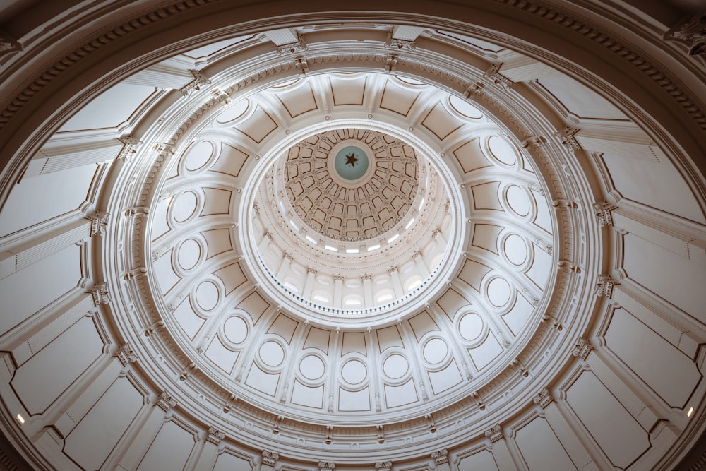 the ceiling of a building with a circular design