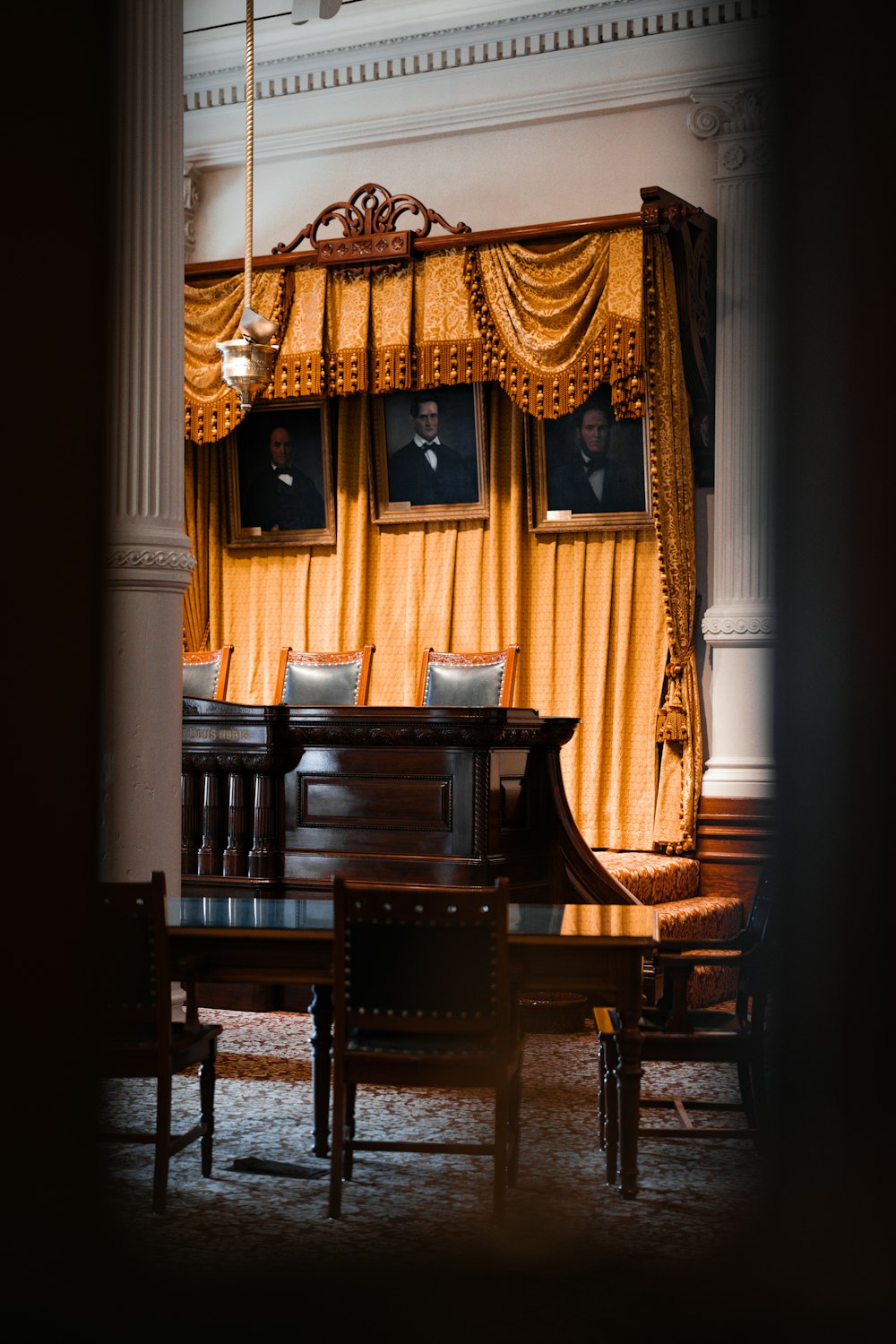 a dining room with a table and chairs