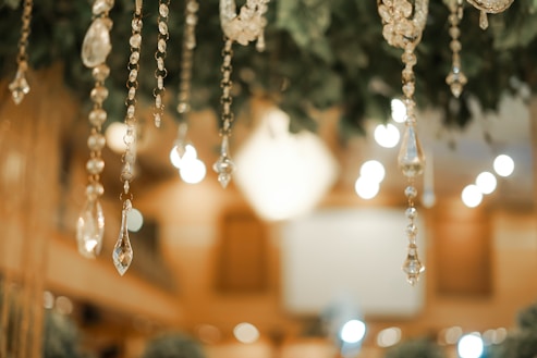 Elegant hanging crystal decorations with a soft focus background, capturing twinkling lights and a luxurious ambiance.