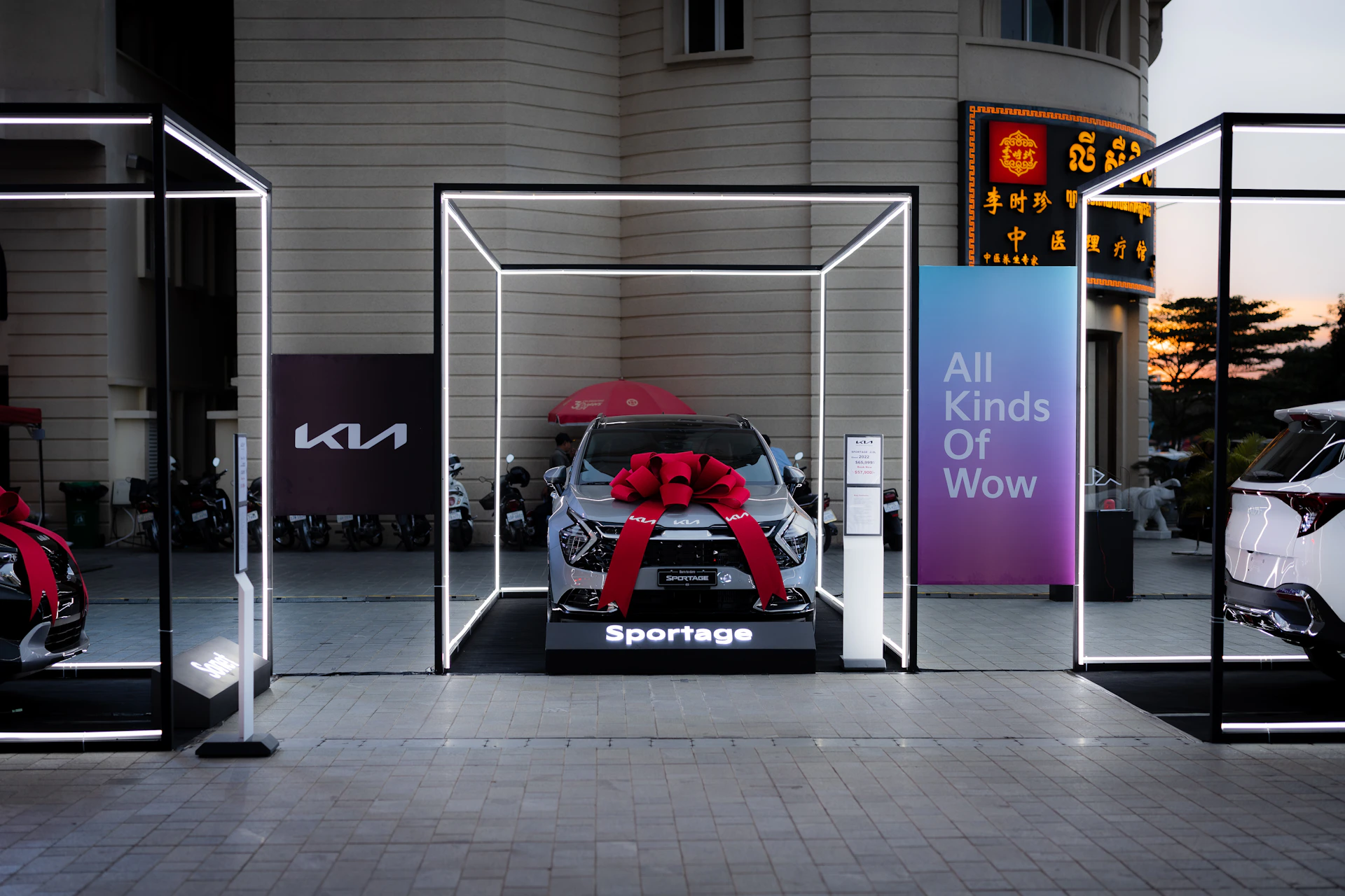 a display of cars with red bows on them