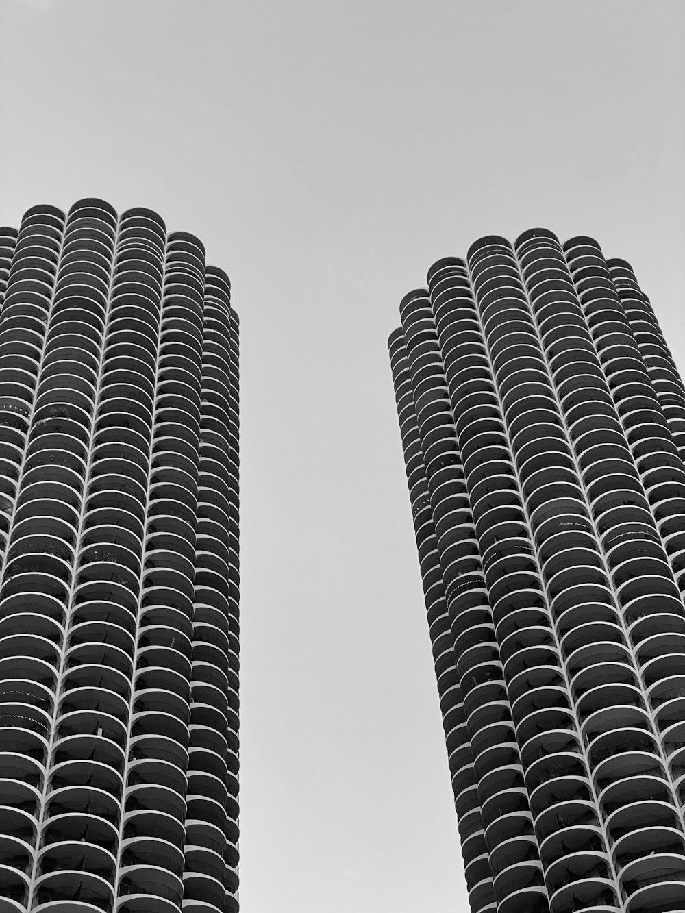 a couple of tall buildings sitting next to each other