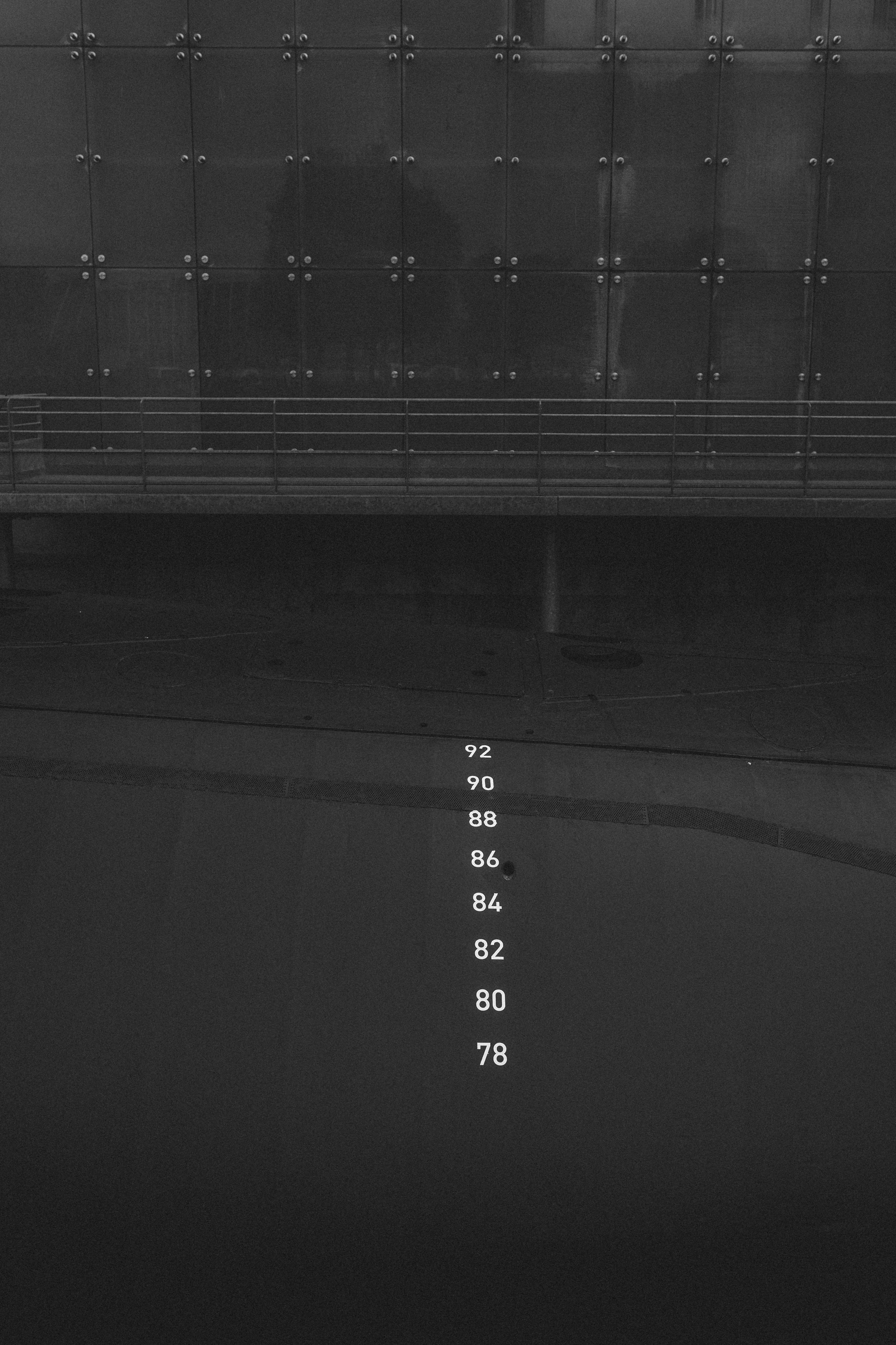 a black and white photo of a bench