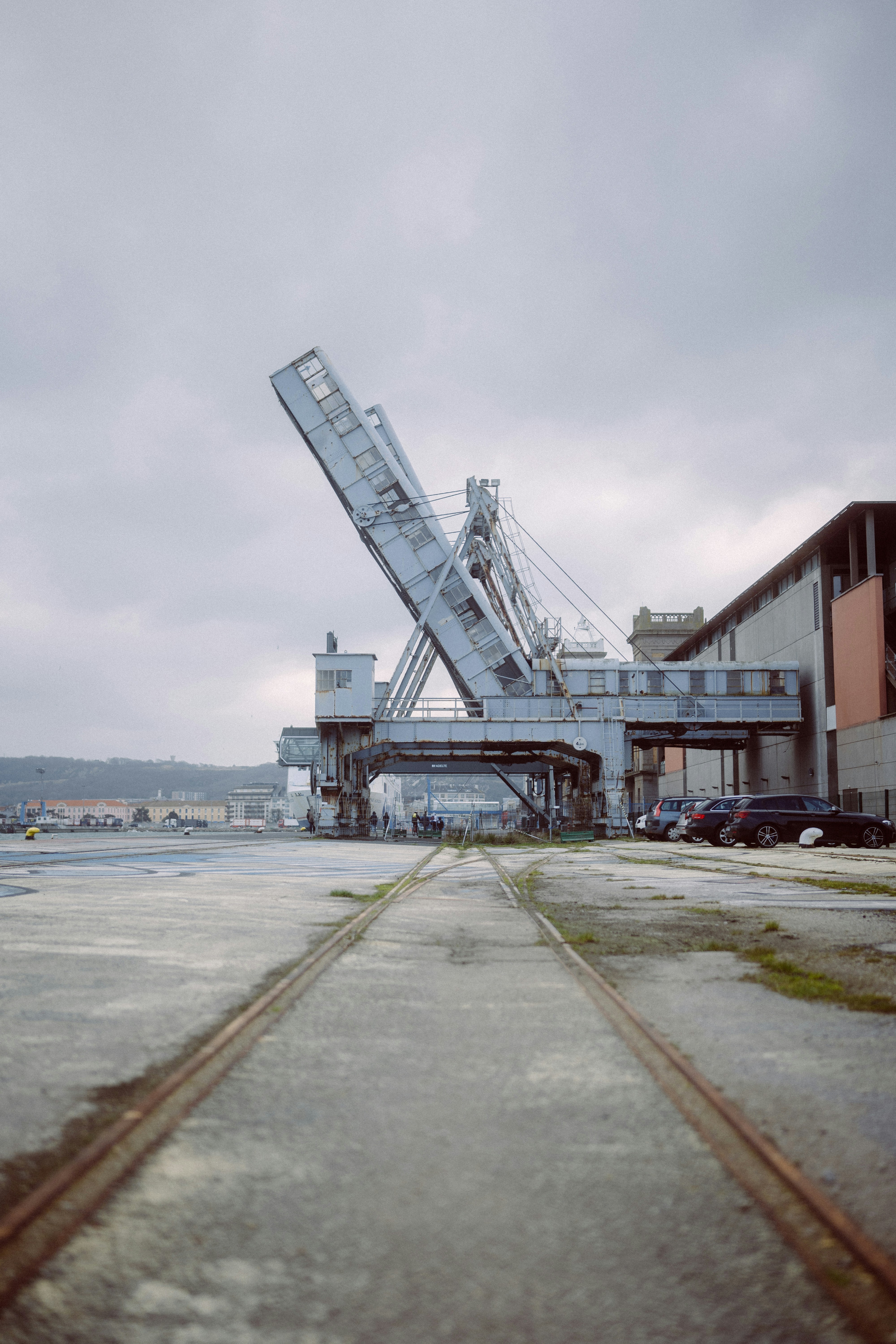 a large crane sitting on top of a train track