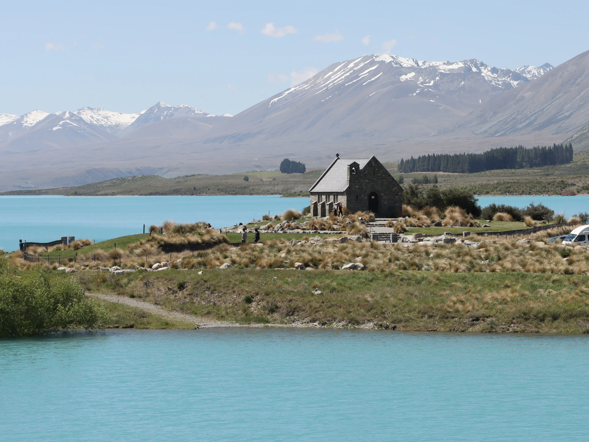 a house on a small island in the middle of a lake