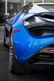 A dynamic shot of a freshly painted car showcasing razor-sharp electric blue accents.