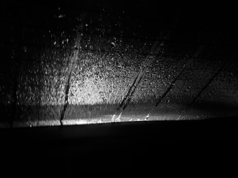 A cinematic still from the upcoming film 'Rain Streak' with moody lighting