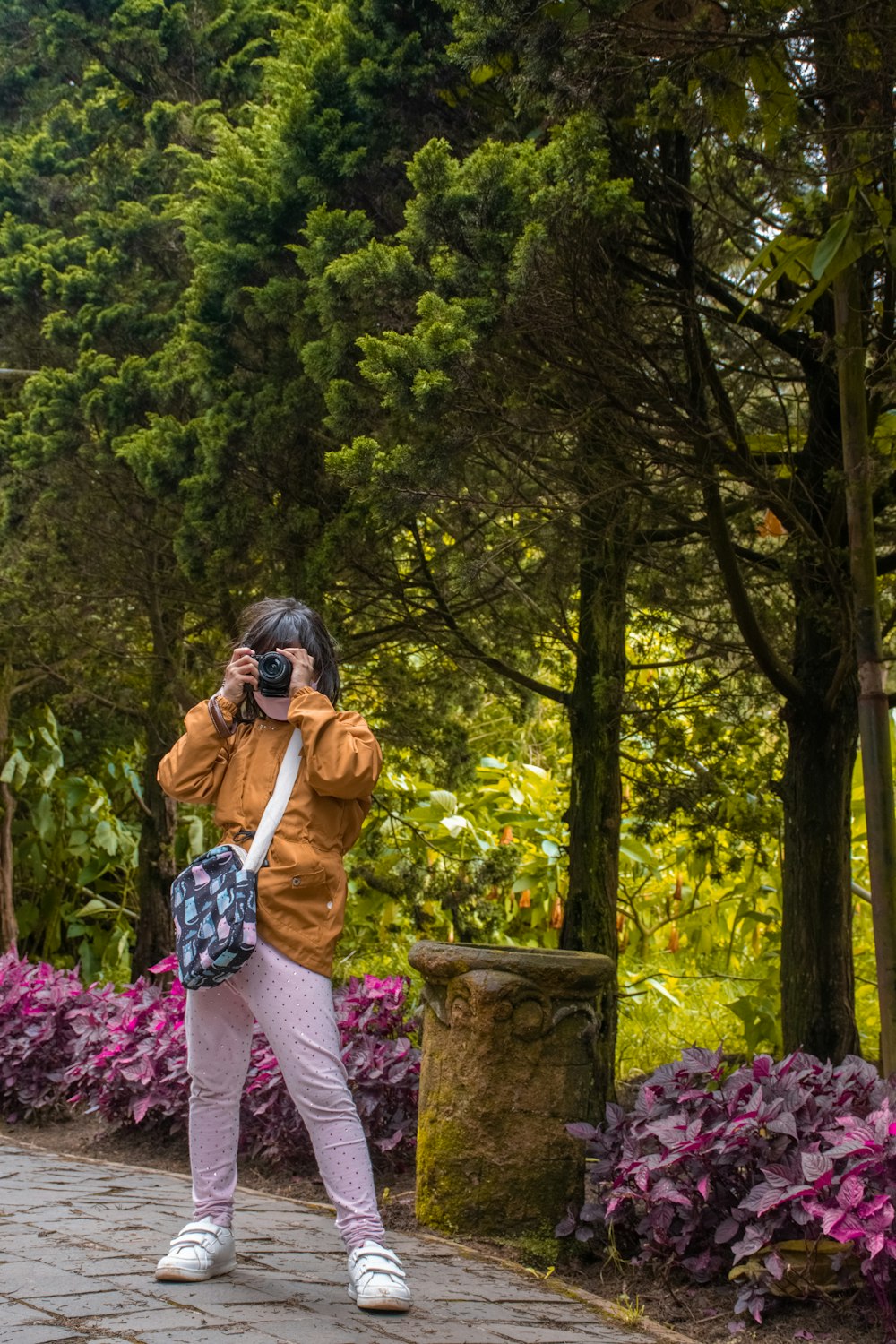 a woman taking a picture of herself with a camera