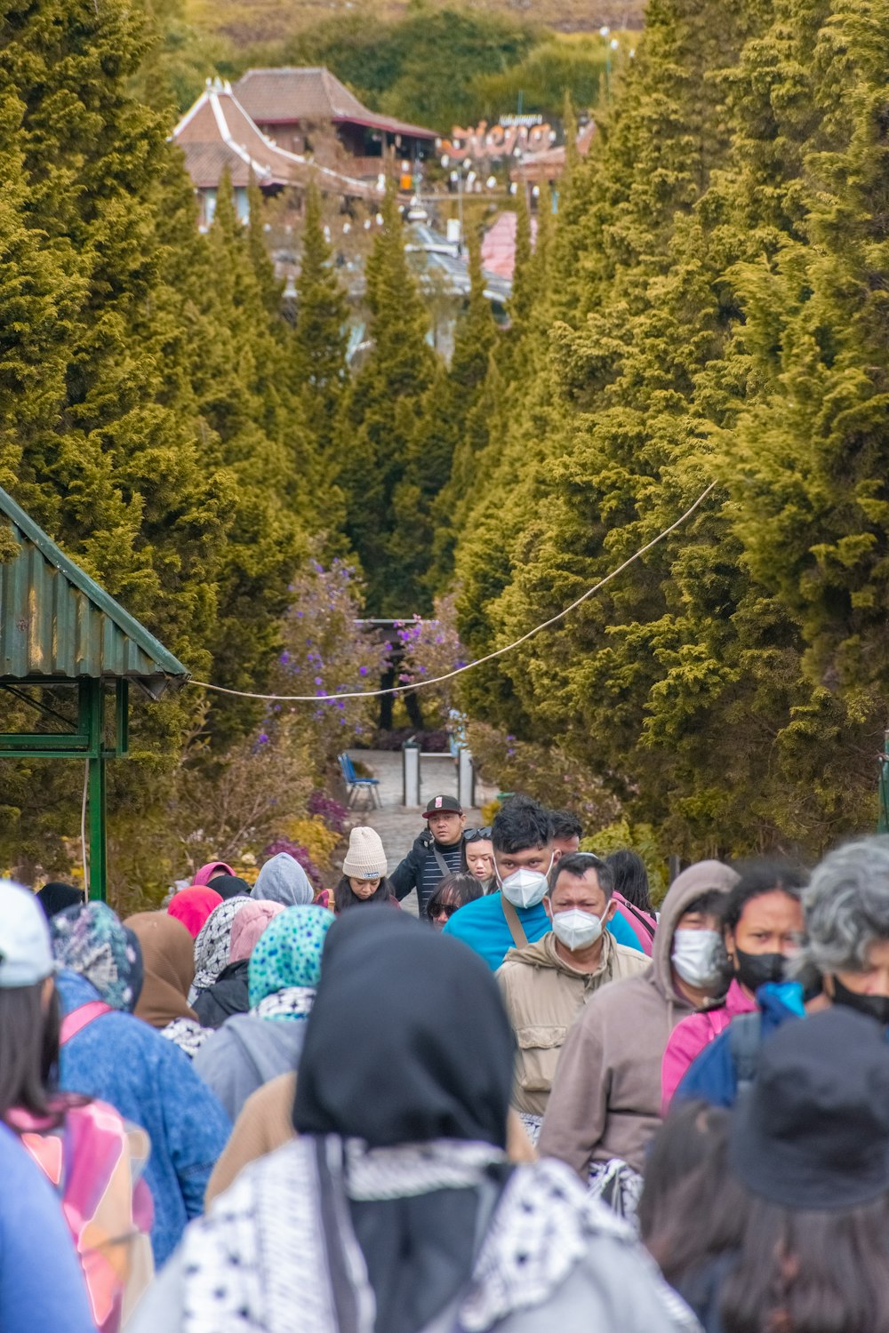 a crowd of people walking down a street