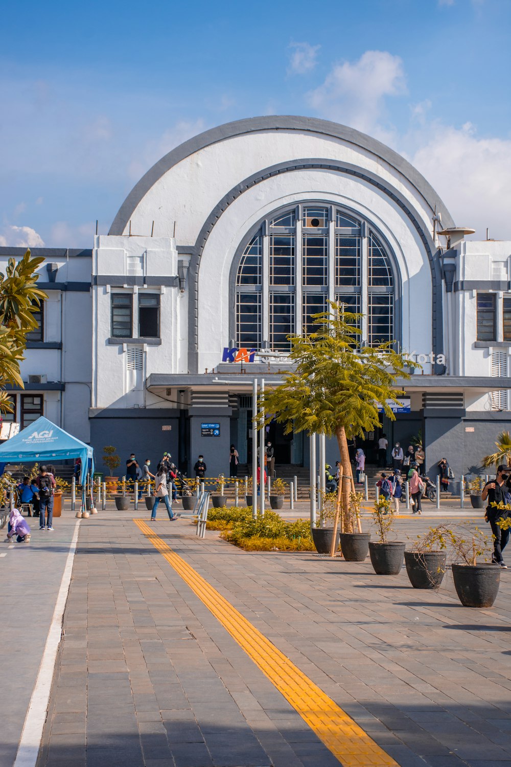 a large white building with a yellow line in front of it