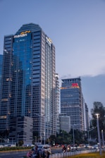 a tall building sitting next to a street filled with traffic
