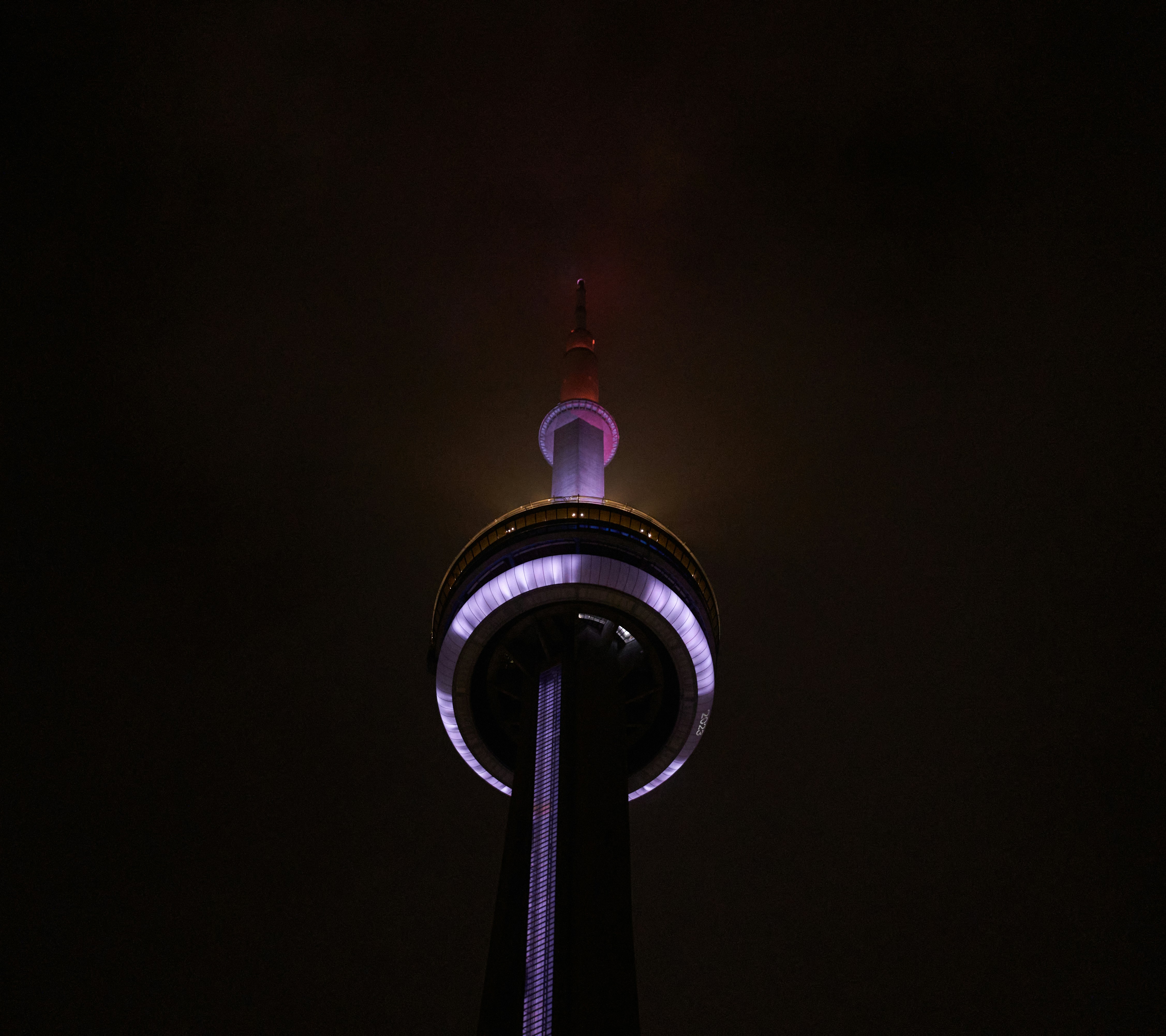 a very tall tower with a clock on it's side