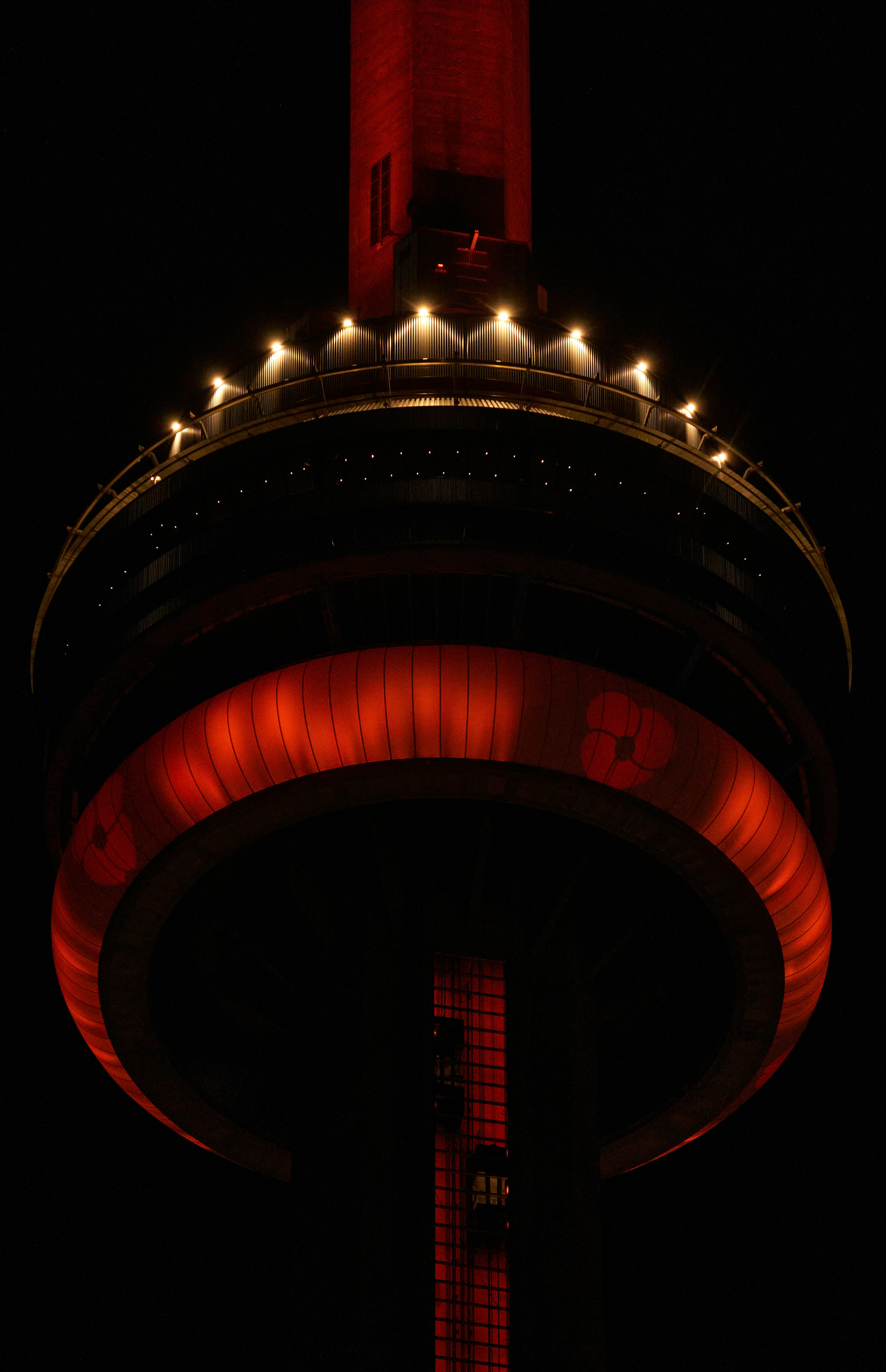 a tall tower with a red light on top of it
