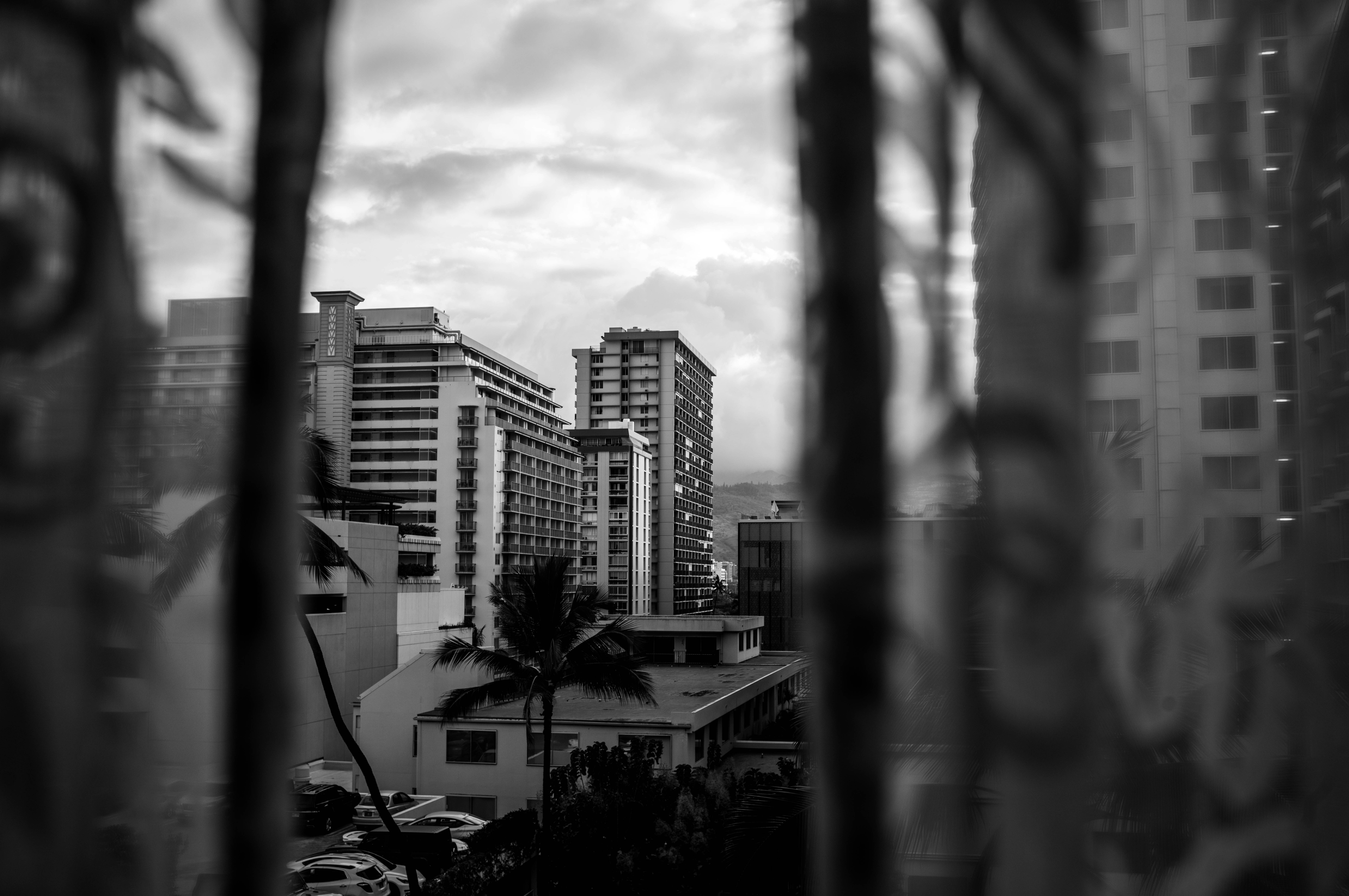a black and white photo of a city with tall buildings