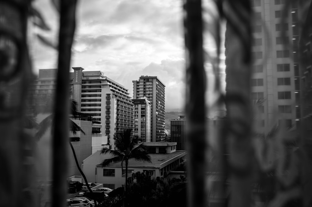 a black and white photo of a city with tall buildings