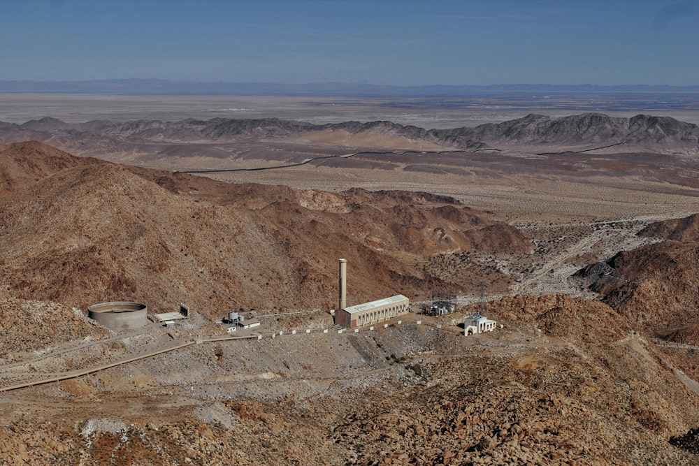 a view of a mountain with a factory in the middle of it