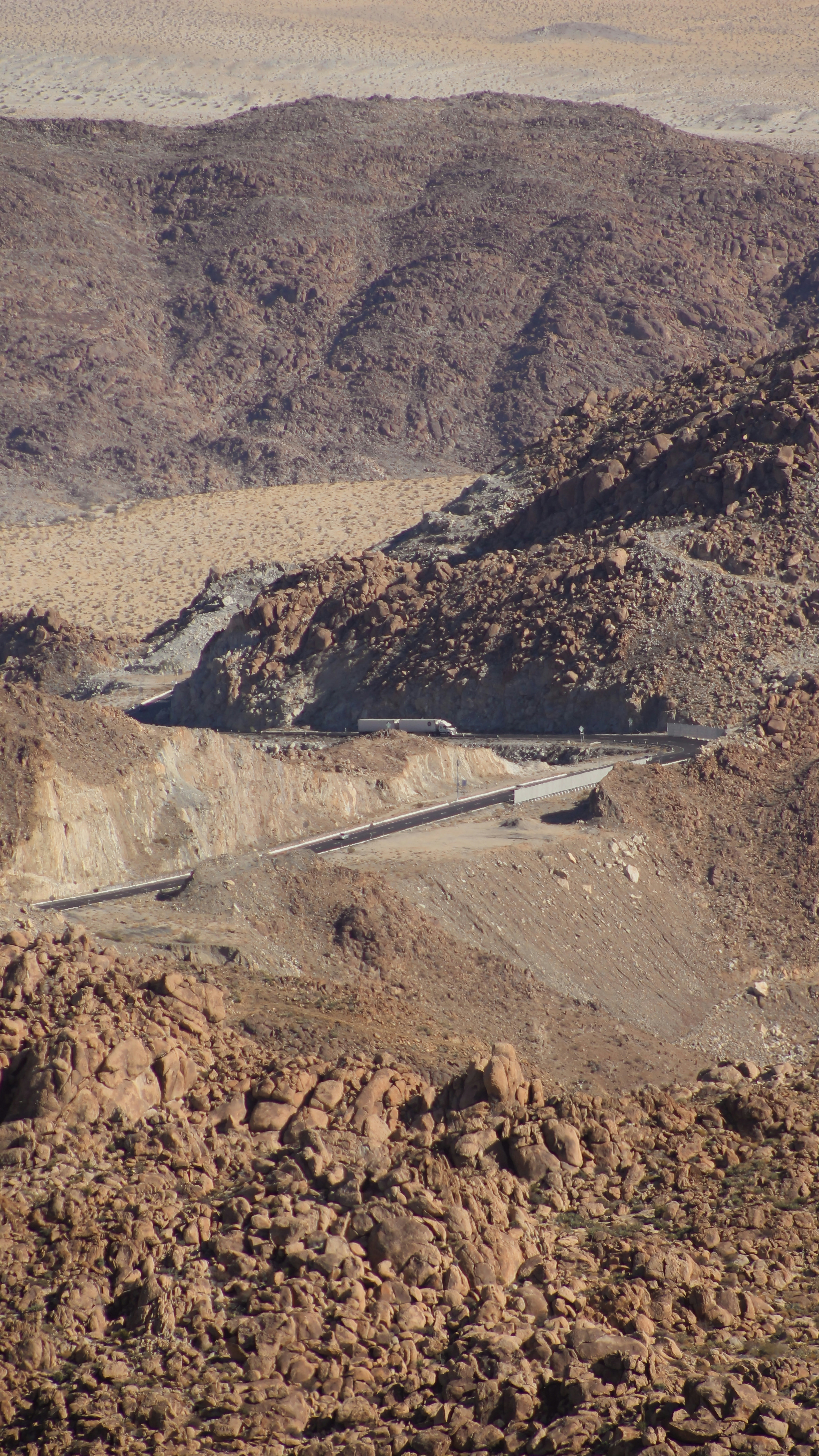 a winding road in the middle of a desert
