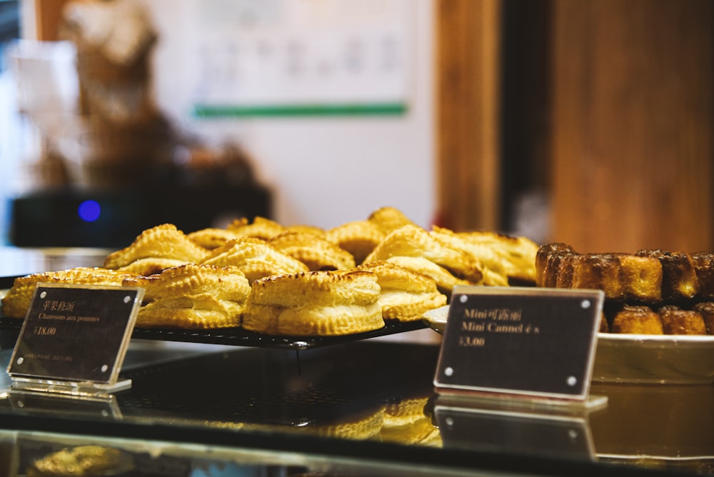 a display case filled with lots of pastries