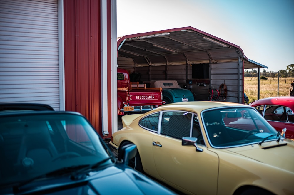 a group of cars parked in front of a garage