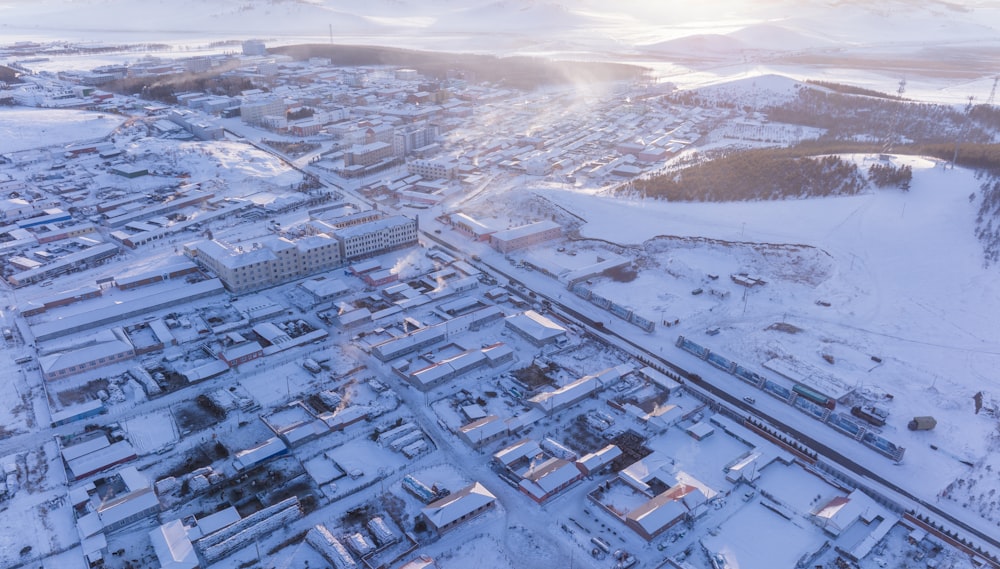 an aerial view of a city in the snow