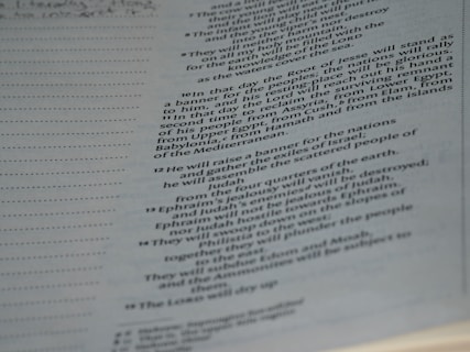 A page from a book, displaying text on the right side, while the left side is blank except for evenly spaced horizontal dots. The text is formatted in a justified style with numbers for each line, indicating a structured layout, likely from a religious or reference book.