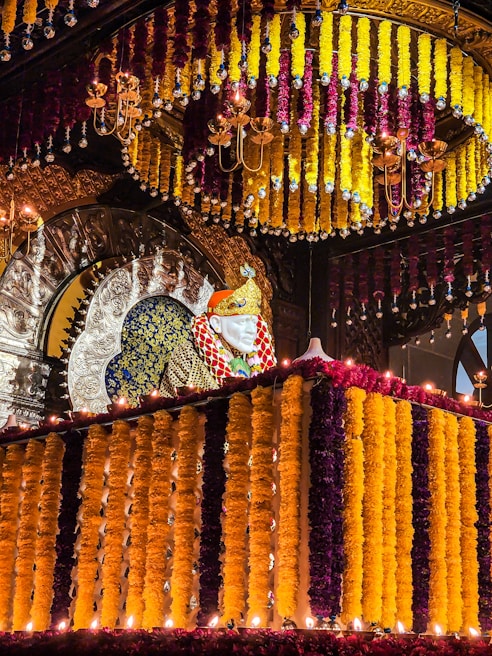 Bright marigold and jasmine flower decorations framing the wedding mandap