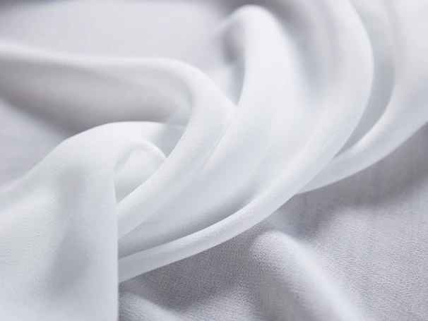 Soft fabric flowing gently, symbolizing delicate laundry detergent care.