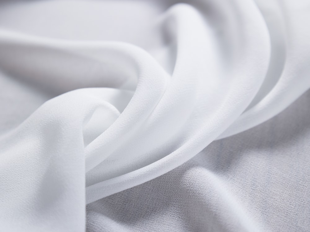 a close up view of a white fabric