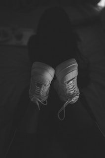 a black and white photo of a pair of sneakers
