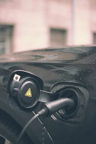 Close-up of a portable type 2 EV charger with smart LCD display and waterproof casing.