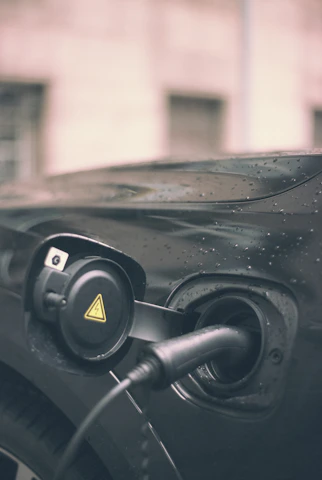 Close-up of a portable type 2 EV charger with smart LCD display and waterproof casing.