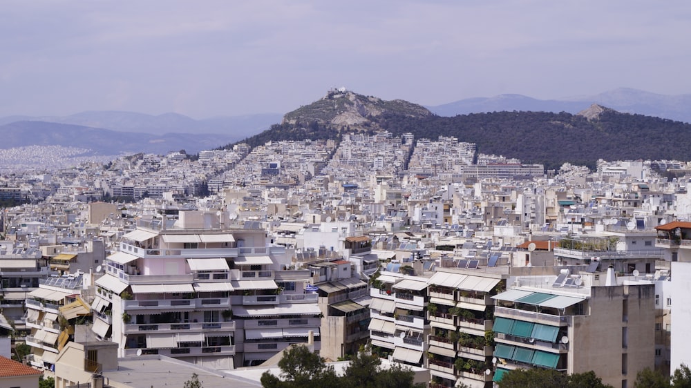 a view of a city with mountains in the background