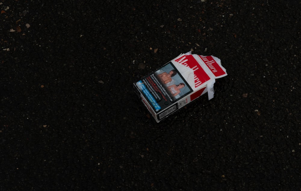 a newspaper laying on the ground in the dark