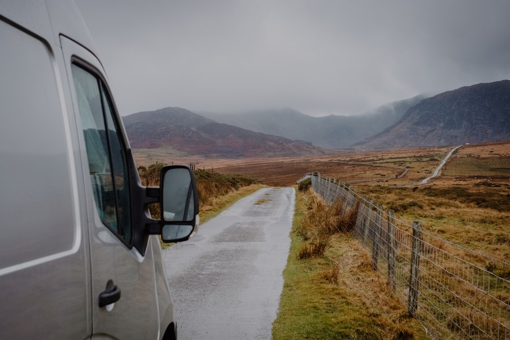 a van is parked on the side of the road