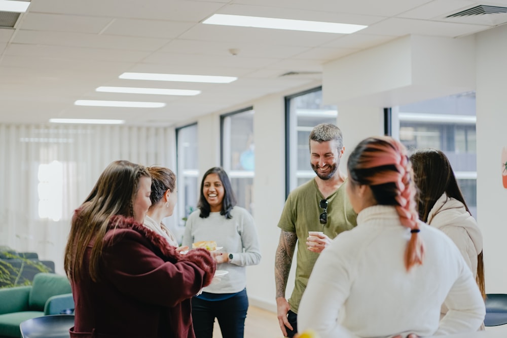 a group of people standing in a room