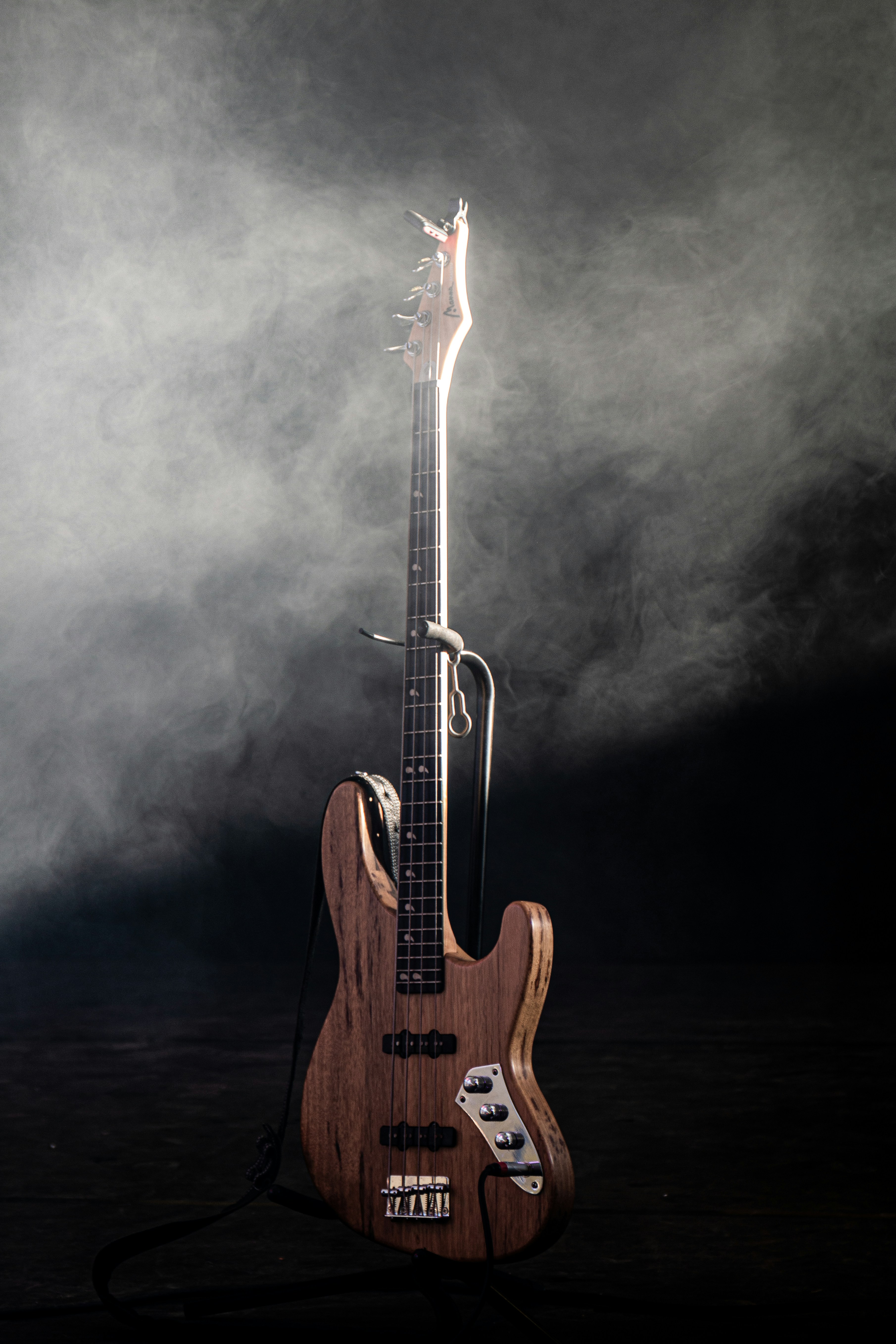 a wooden guitar with a microphone attached to it