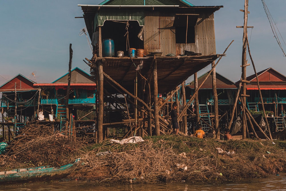 a house on stilts on a body of water