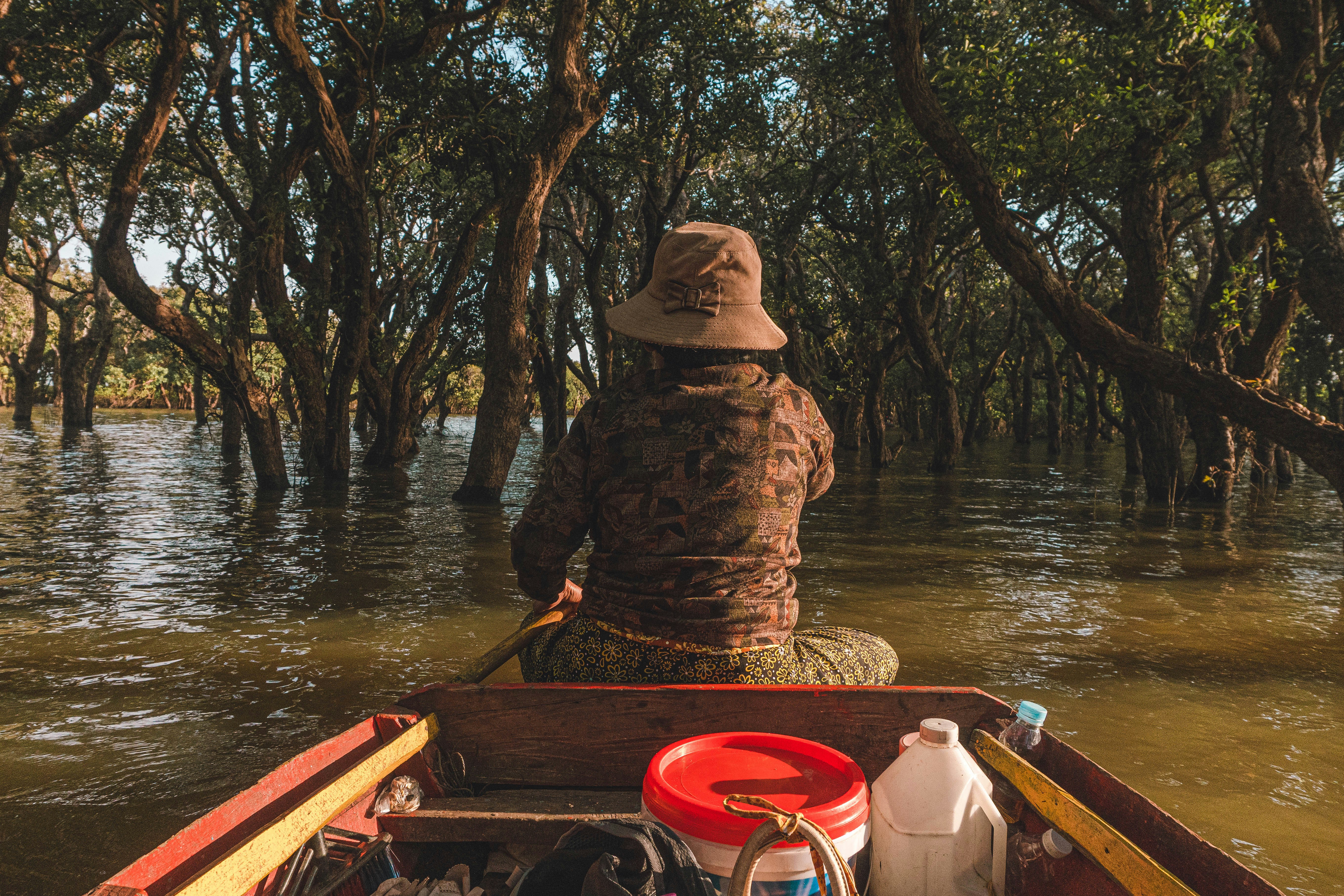 a person riding in a boat on a river