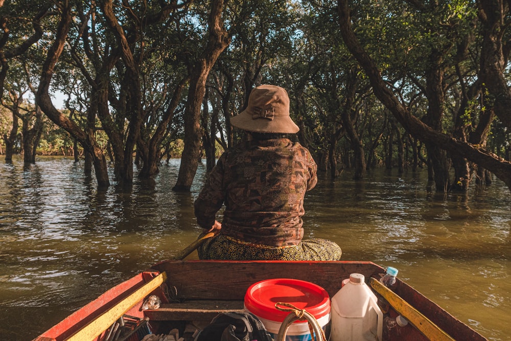 a person riding in a boat on a river